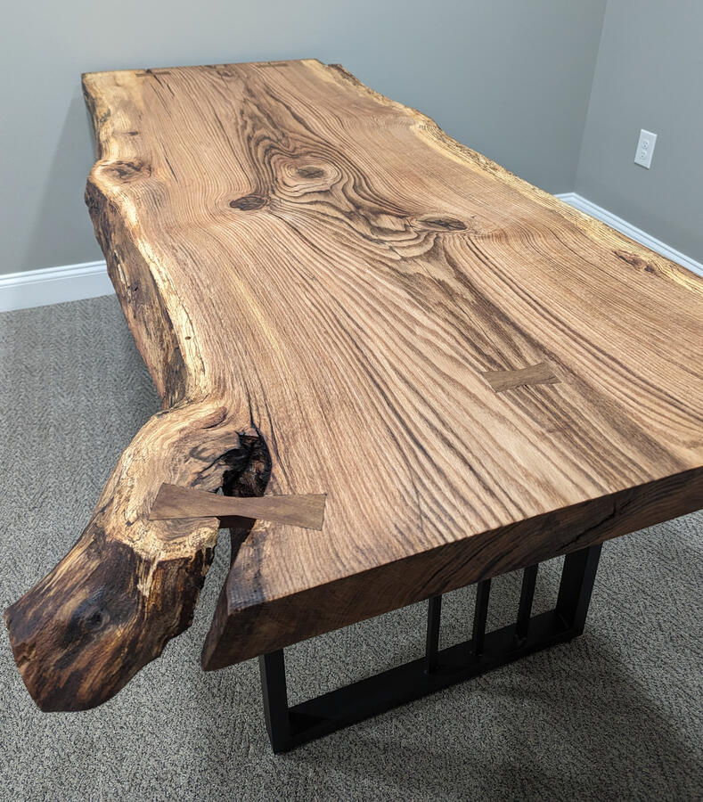 Live edge Pin Oak desk featuring hand cut bowties and metal legs Live edge Pin Oak desk featuring hand cut bowties and metal legs